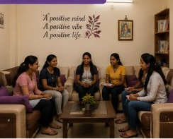Common lounge with residents relaxing on sofas