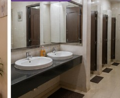 Clean communal washroom with modern sinks